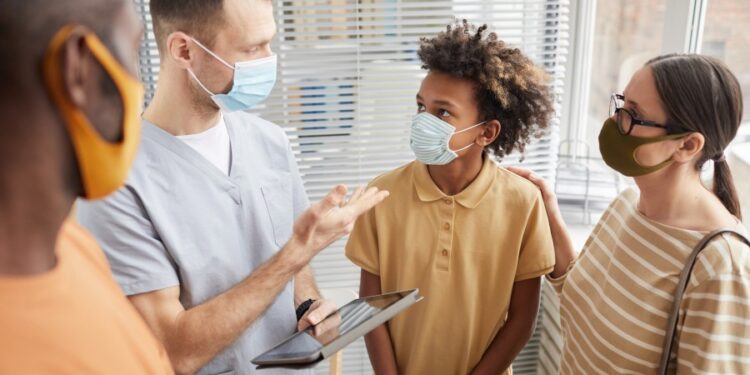 Family at doctor's visit_900x600