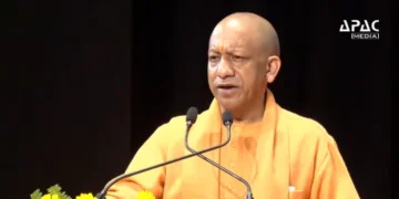 Uttar Pradesh Chief Minister Yogi Adityanath hands over land allotment letters to key companies in the YEIDA region, highlighting policy stability, infrastructure growth and rising investments, including in semiconductor and electronics manufacturing.